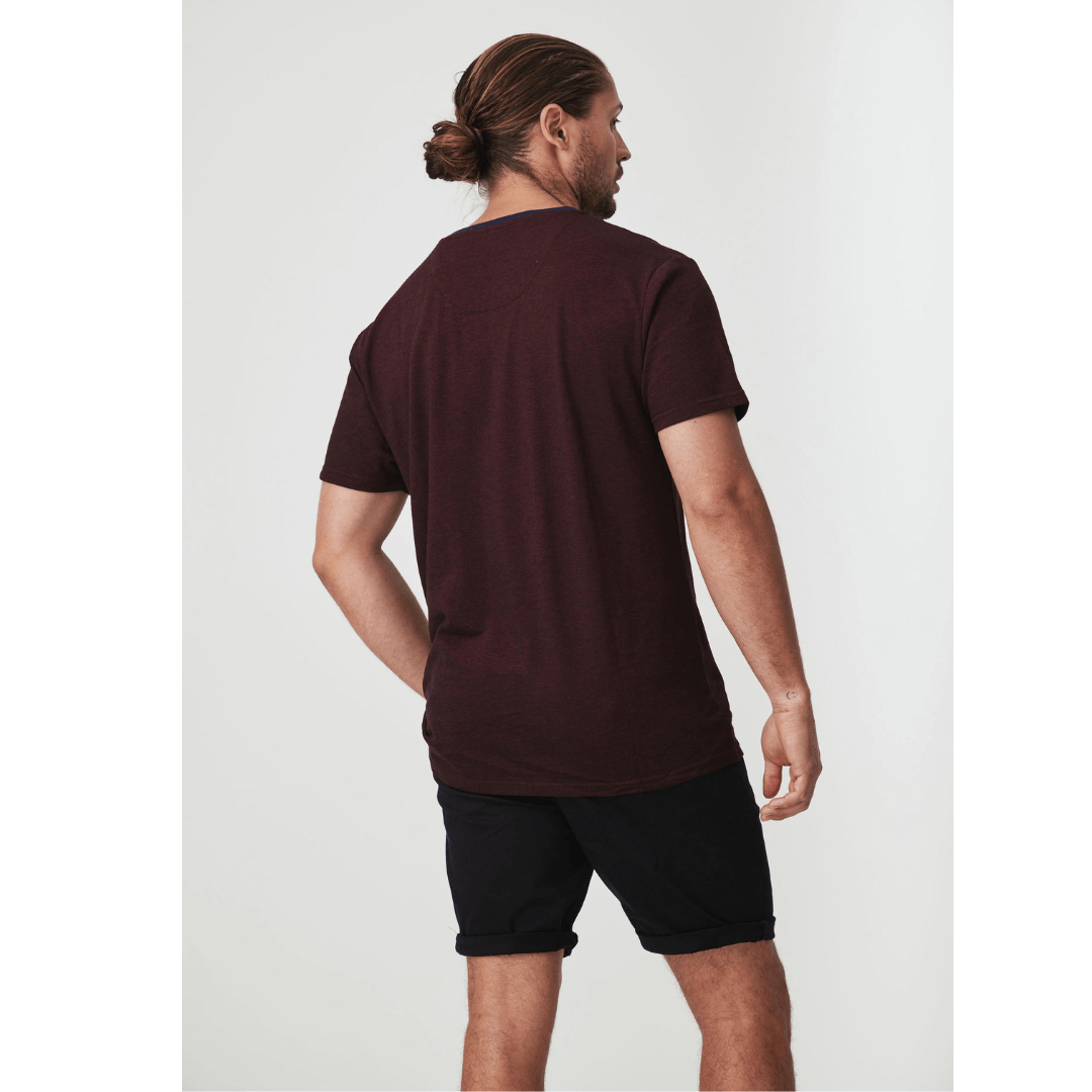 Stewart's Menswear Blackwood Apparel Fox Henley Tee. Round neck featuring a buttoned half-placket fastening for an authentic Henley look. Colour is Burgundy. Photo shows model wearing Blackwood Fox Henley Tee back view.