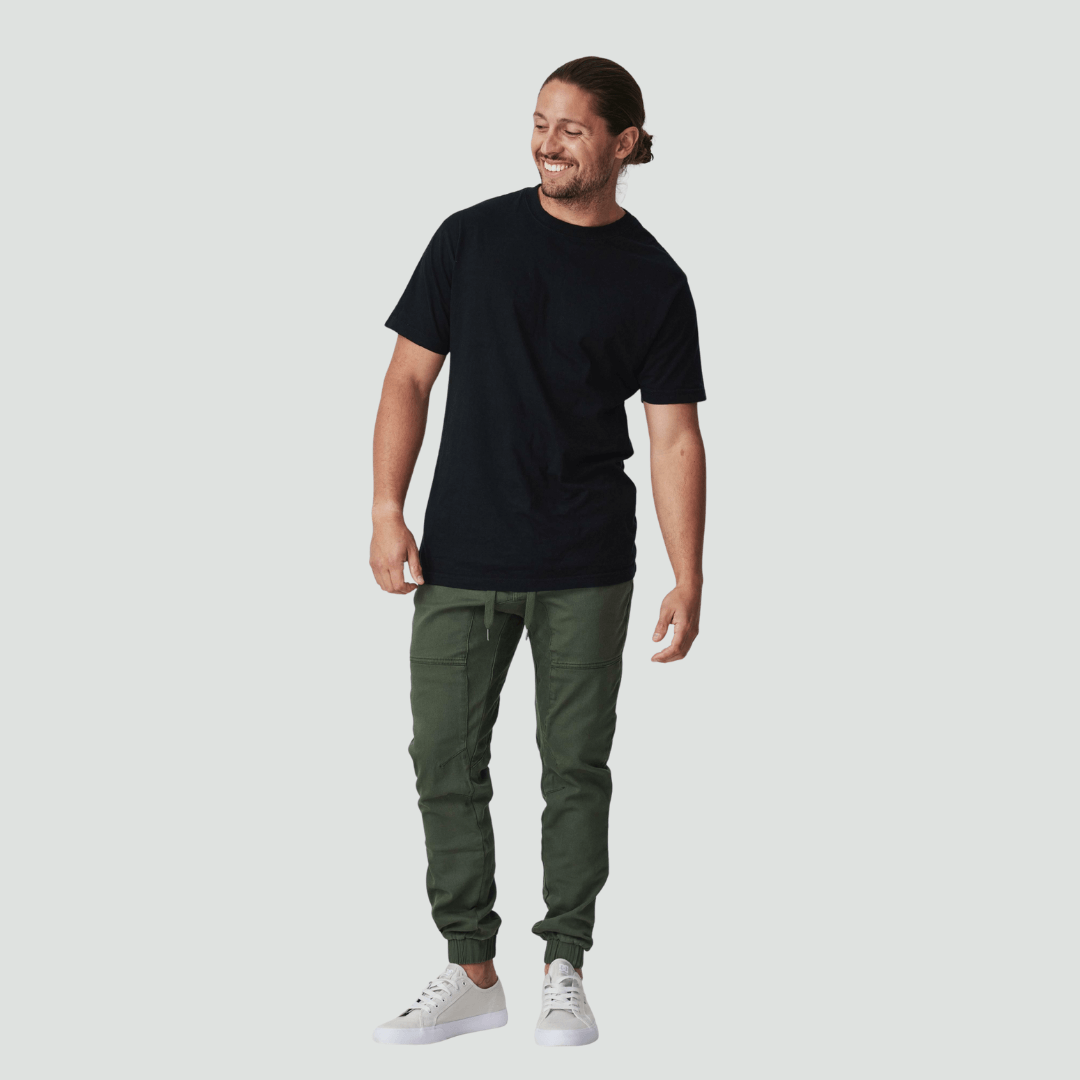 Model wearing James Jogger Pants in Military coloured cotton stretch fabric available at Stewart’s Menswear Mullumbimby.