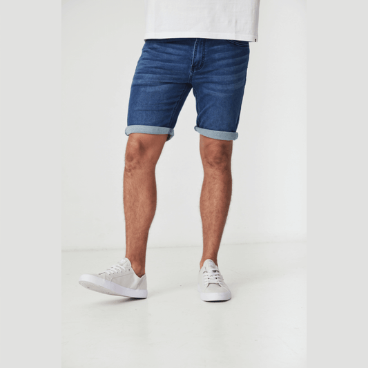 Stewarts Menswear Blackwood Apparel Perth Denim Shorts. Photo shows model wearing Perth denim shorts, colour is medium blue, front view. Can be worn rolled up or down.