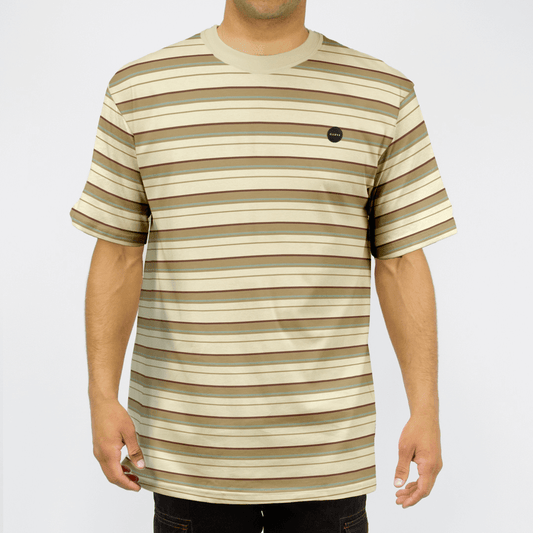 Carve Vintage Short Sleeve Tee available at Stewart’s Menswear Mullumbimby. Regular fit men’s striped cotton jersey t-shirt with chest badge. Light cream base colour with brown yarn dyed stripes.