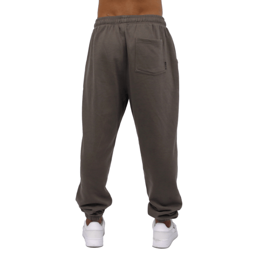 Back view of Carve Bowen Track Pant in driftwood available at Stewart’s Menswear Mullumbimby. Regular fit track pants with elastic waist, ankle cuffs and angled pockets.