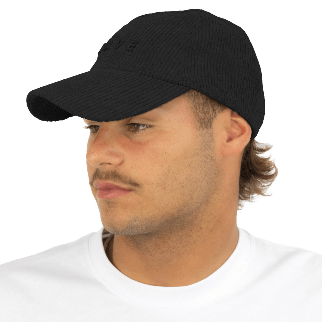 Stewarts Menswear Carve Unisex Manchester Cap. Curved Peak cap made from corduroy with 3D Carve embroidery on front and adjustable snap back. Colour is Black.