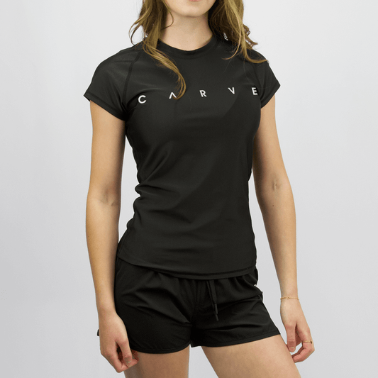 Front view of Carve Palmira Cap Sleeve Rash Vest. Women’s black stretch rashie with Carve chest print, available at Stewart’s Menswear Mullumbimby.