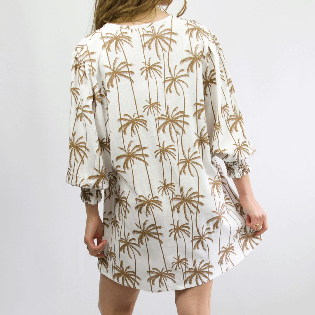 Sobi Beach Cover up available at Stewart's Menswear. Back view of Relaxed women’s beach cover-up with puff sleeve, tassel cord, and printed viscose-linen fabric.