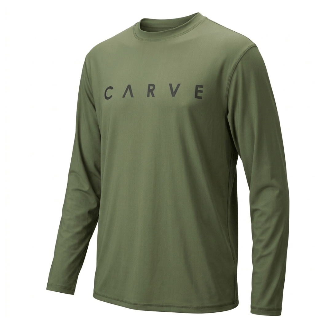 Carve Men’s Long Sleeve Swim Rashie. Relaxed-fit rash vest with UPF 50+ sun protection, available at Stewart’s Menswear Mullumbimby. Colour is khaki with small Carve print on front chest