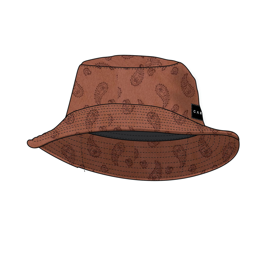 Stewarts Menswear Carve surfwear Kashmir bucket hat. The Carve Kashmir Bucket Hat is a trendy sun accessory. Not only will this hat shield you from the sun, but it will also make you look good. Made from 100% cotton with an all over paisley print, it is ideal for fun in the summer sun. Colour is rust with allover paisley yardage print.