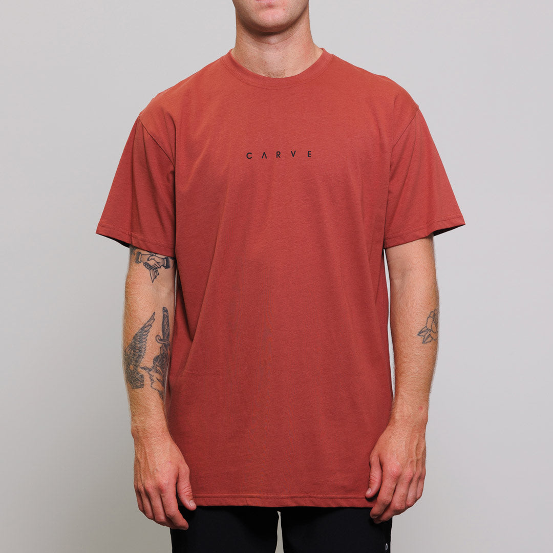 Stewarts Menswear Carve Surfwear Pipeline Tee. This is a regular fit men's short sleeve T-shirt with mini Carve centre chest print. Colour is mahogany.