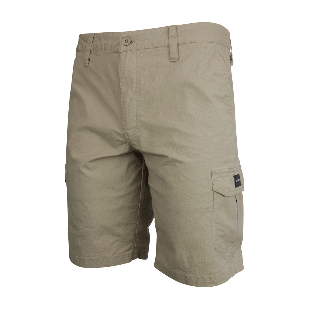 Stewarts Menswear Carve Surfwear Saltbush Cargo Shorts. Men's regular fit fitted waist short featuring button front with zip fly and 20" leg length, these Carve Saltbush Cargo Walk shorts are ideal for the man on the go.  With angled side pockets, back welt pocket and lower leg cargo pockets, there is plenty of room for all your accessories, such as car keys, wallet, passport etc. Perfect for a day out or for travelling. Colour is Sand