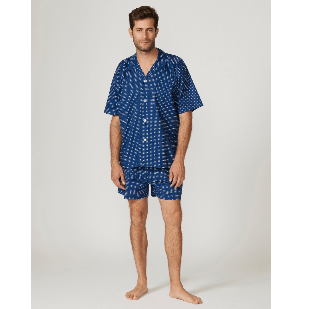 Stewarts Menswear Contare Featherweight pure cotton short sleeve pyjama set. Colour is navy with small white print all over. Photo shows model wearing contare Featherweight 100% cotton pajamas, front view