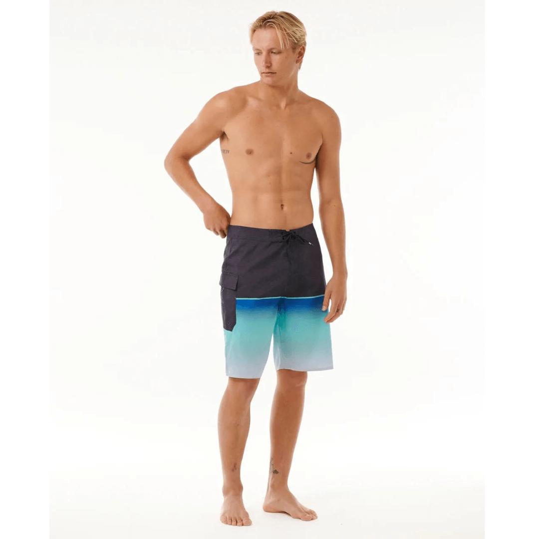 Stewart's Menswear Rip Curl Dawn Patrol Boardshorts. Black top half with gradient blue bottom half. Photo shows front view of model wearing Rip Curl Dawn Patrol boardshorts. Colour is called Electric Cobalt.