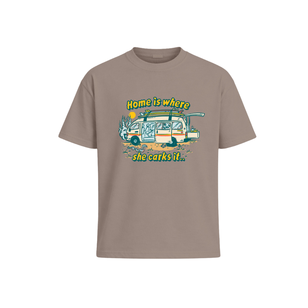General Store Merchandise Carked It Tee in taupe, a relaxed cotton tee with a broken down campervan print and Home is where she carks it slogan, available at Stewart's Menswear Mullumbimby.