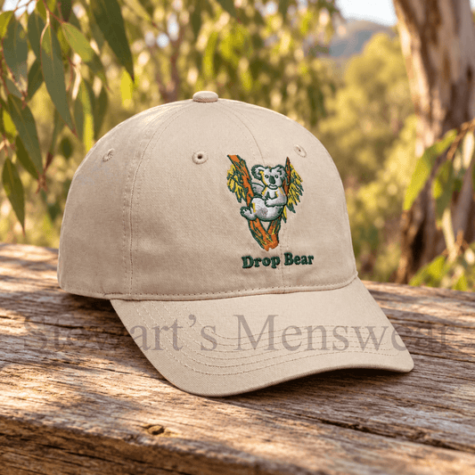 Drop Bear Cap in stone, a 6-panel cap with an embroidered koala in a gum tree and Drop Bear lettering, available at Stewart's Menswear Mullumbimby.