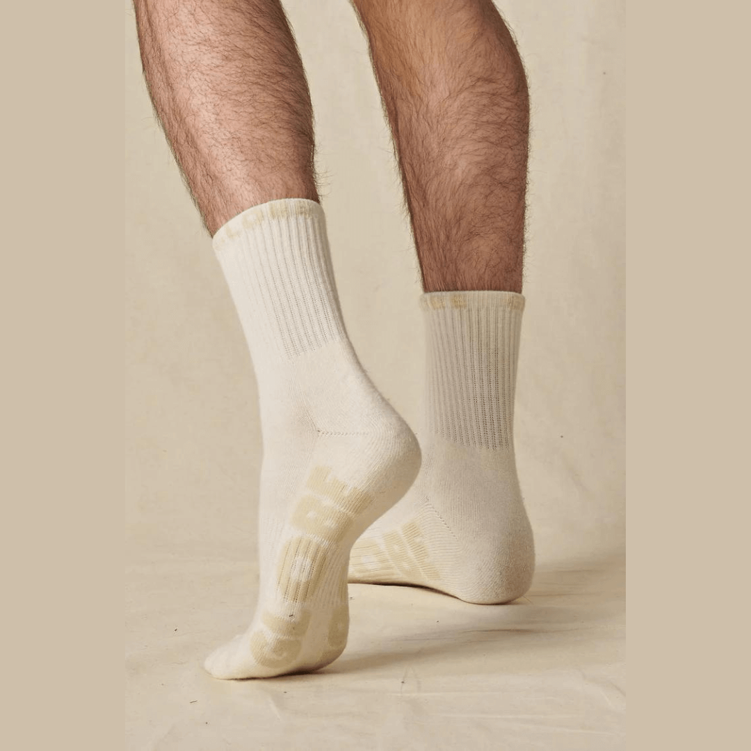 Stewarts Menswear Globe crew socks bleach free 3 pack. These Globe 3 Pack crew socks are the perfect budget friendly addition to any skater's wardrobe. Made with 75% organic cotton, they provide comfort and durability while reducing the impact on the environment. Lifestyle photo of man wearing Globe bleach free crew socks.