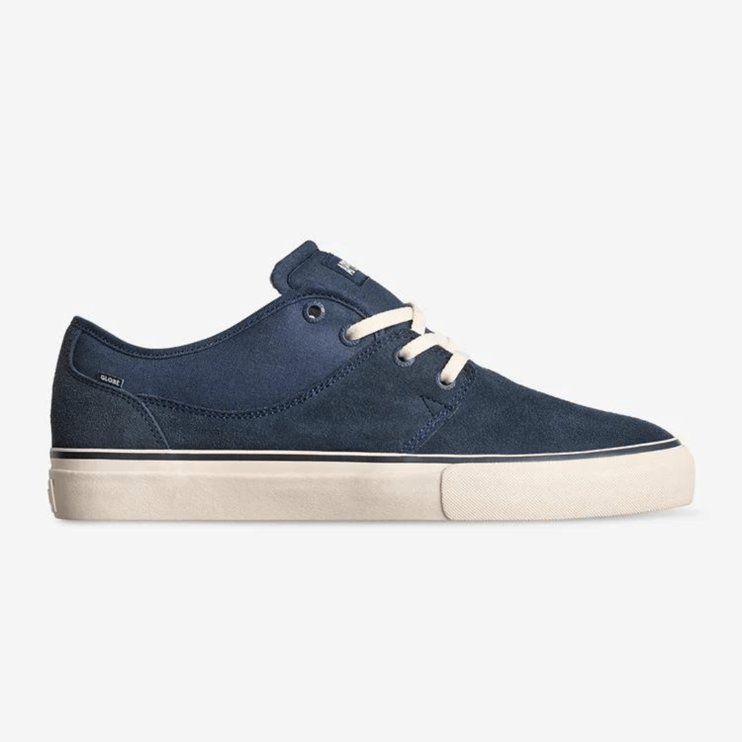 Stewarts Menswear Globe Mahalo Navy Antique side view. Designed for skateboarding with Mark Appleyard, The Mahalo in Navy/Antique is a proven classic. The upper is made from Suede and canvas and features Globe's Shockbed™ insole for impact control and Super-V™ out-sole for enhanced grip and board feel. 