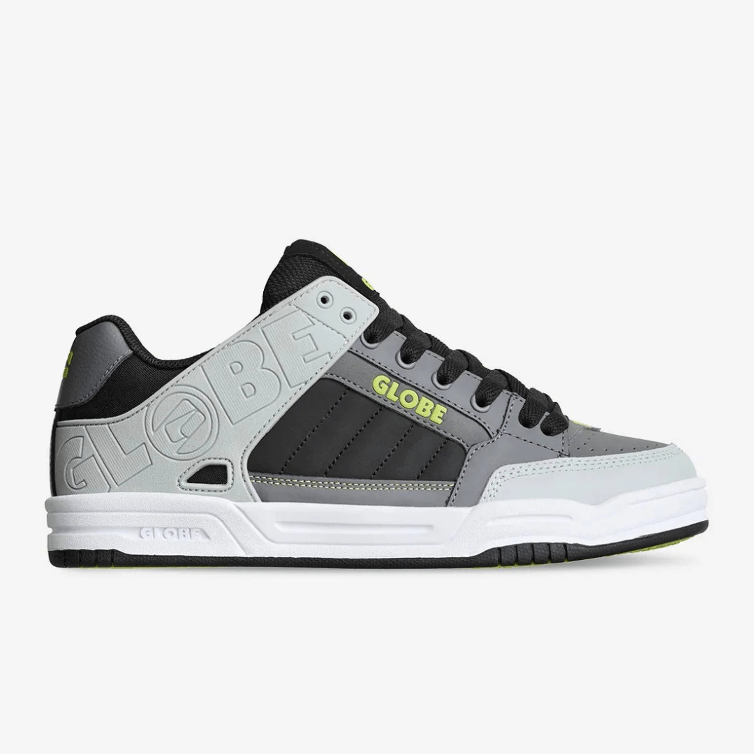 Globe Tilt Skate Shoe  available at Stewart’s Menswear Mullumbimby. Classic heritage skate shoe predominantly white and grey with black trim ad white around sole.