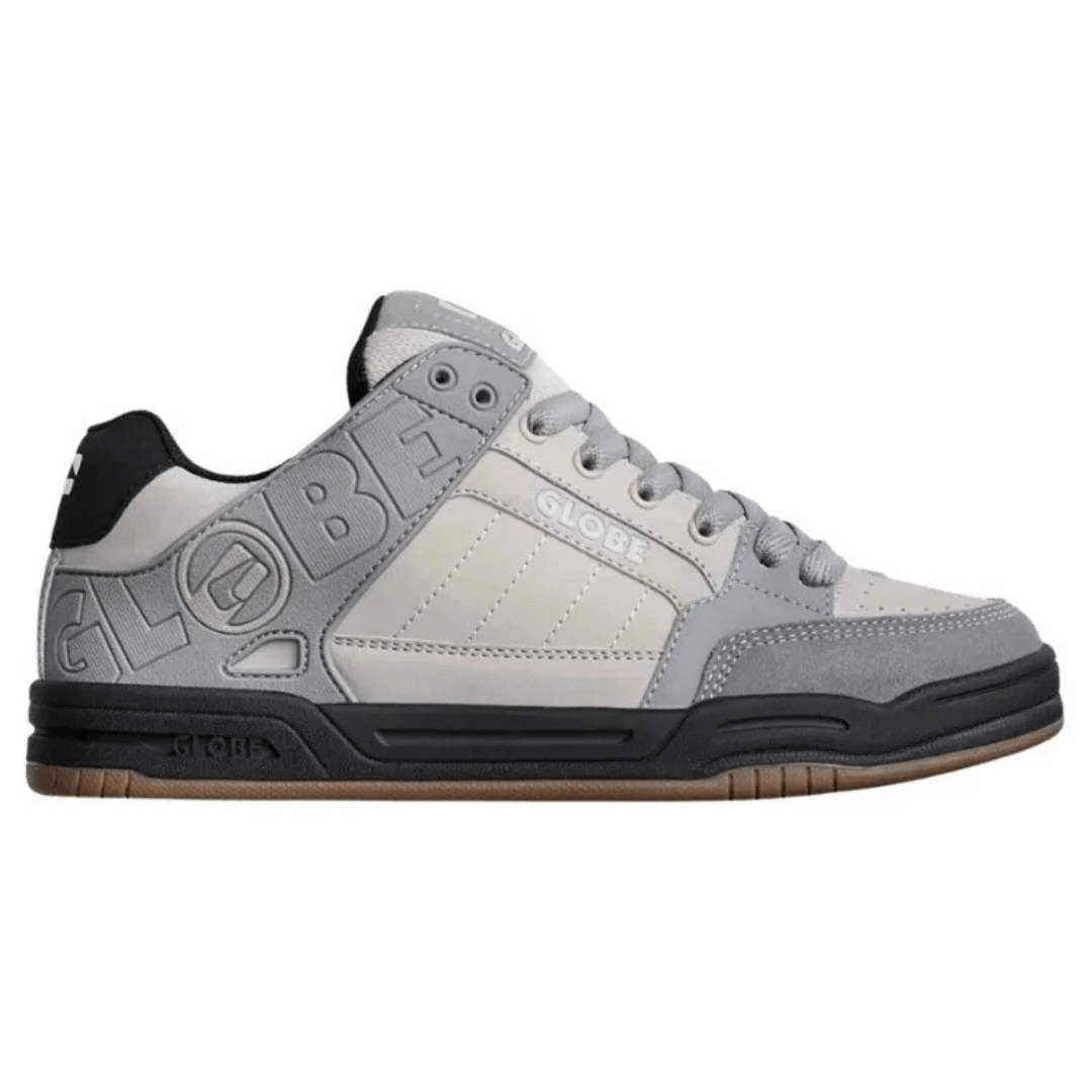 Globe Tilt skate shoe available from Stewart's Menswear, Mullumbimby. Side view of Globe Tilt Silver/grey coloured shoe with black trim.