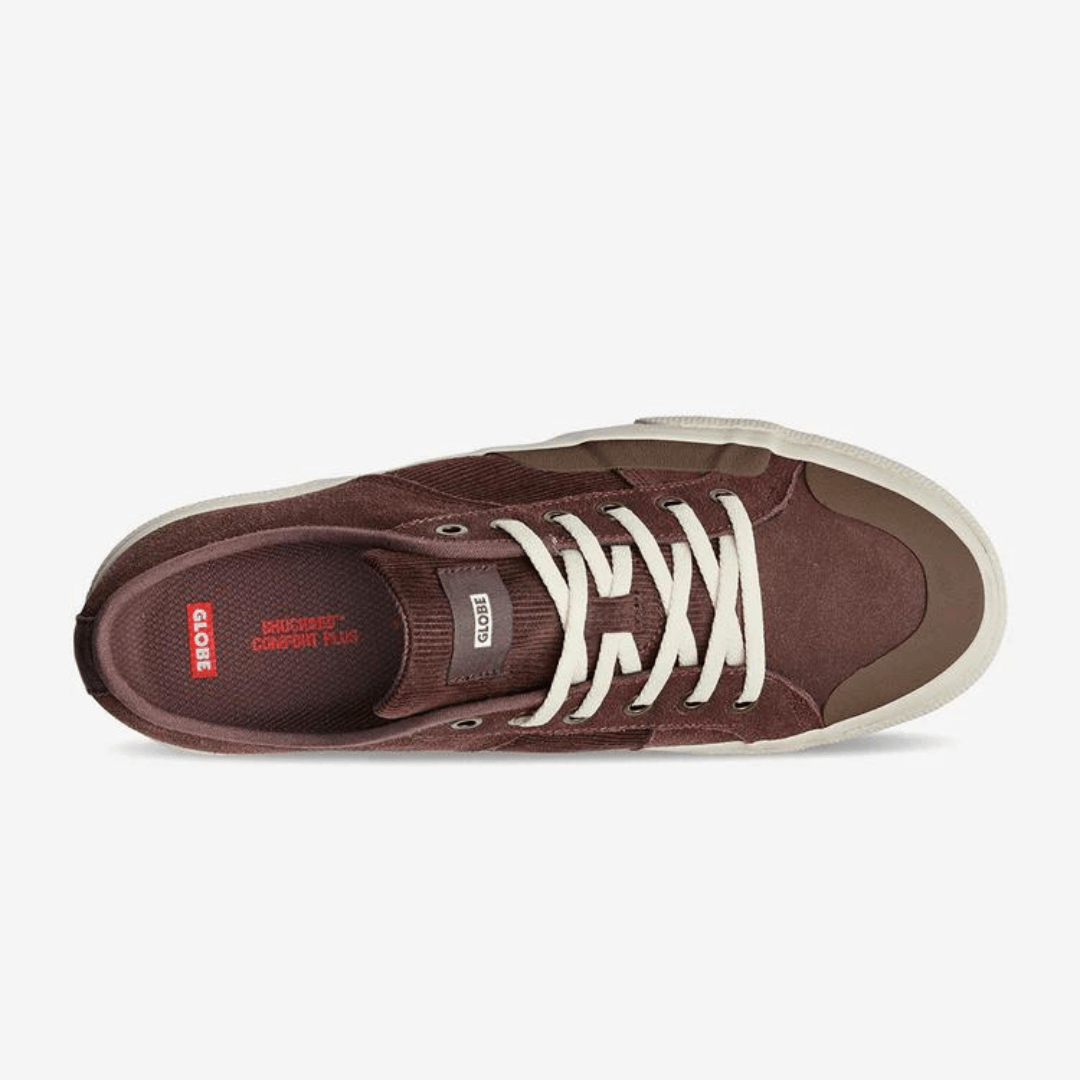 Stewarts Menswear Globe Surplus Skate Shoe. Colourway is Mongoose upper with vulcanised antique coloured sole. Mongoose is a rich chestnutty colour. Features cord detail on side panels and tongue of shoe. Photo shows top view.