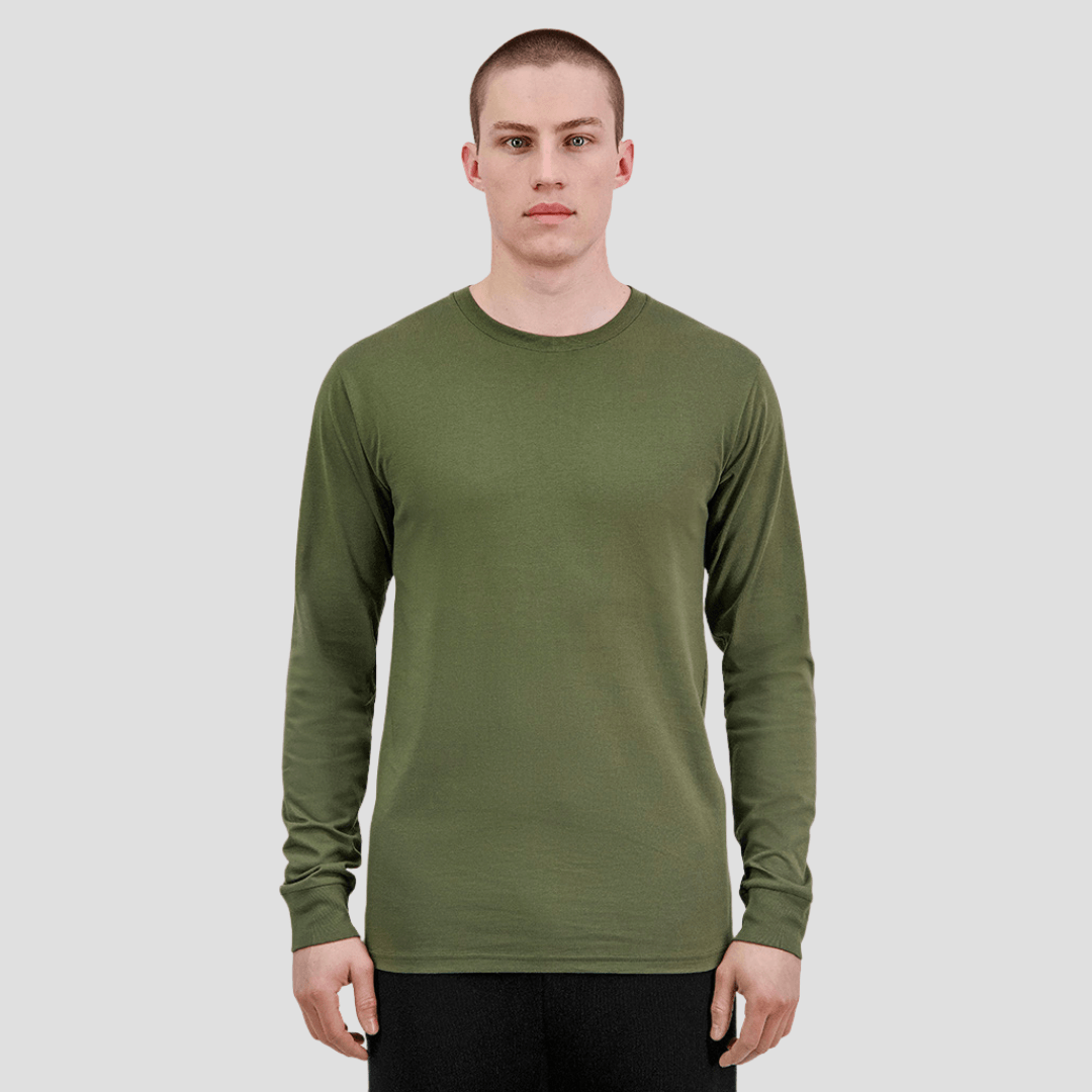 Model wearing Goodmates Basis Long Sleeve Tee in army green, classic fit cotton jersey shirt with UPF 50+ available at Stewart's Menswear Mullumbimby.