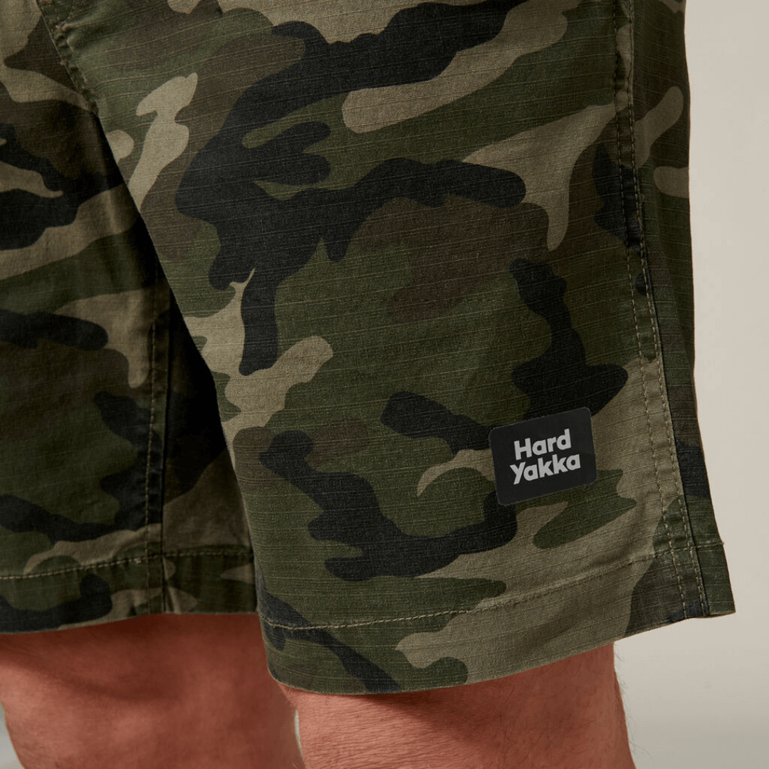 These stylish active Camo shorts are the perfect addition to your wardrobe. With an elastic waist and made from cotton rich stretch ripstop fabric, they are both comfortable and durable. Featuring a stylish on trend camo print, slim fit with plenty of pockets.  Photo is close up of the stretch rip stop fabric.