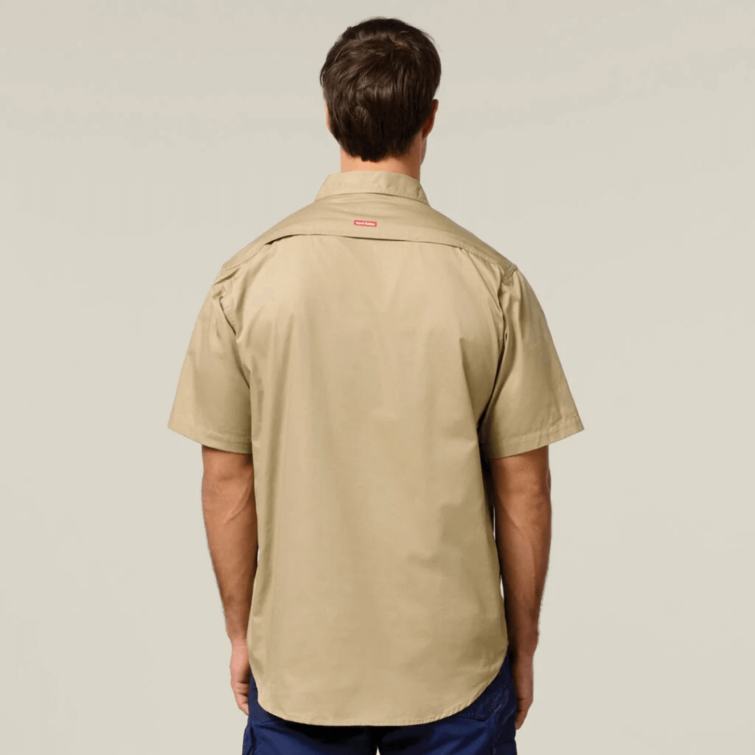 Back View of Khaki coloured Hard Yakka Core Short Sleeve Lightweight Vented Cotton Shirt with mesh venting and twin chest pockets, available at Stewart’s Menswear Mullumbimby.
