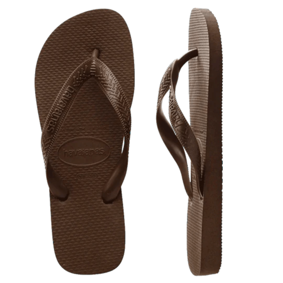 Stewarts Menswear Havaiana Top, Brown. Get ready to hit the beach with a summer staple, the Havaiana Top Thongs. A pair of basic thongs are a must have for your summer wardrobe.  Made in Brazil, since 1962, Havaianas were inspired by the Japanese Zori sandal.  Overhead view of a pair of Havaiana Top thongs. Footbed, straps and logo are all coloured Brown.