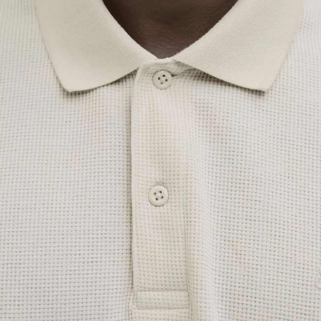 Close up photo showing fabric texture of Jack & Jones Austin Polo Shirt in moonbeam, men's cotton jersey polo with classic collar, available at Stewart's Menswear Mullumbimby.