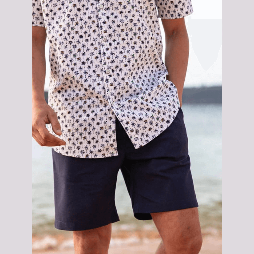 Stewarts Menswear Jimmy Stuart Australian Made Bahamas Cotton Linen Shorts.Jimmy Stuart Bahamas Cotton/Linen Shorts are Australian-made unisex shorts, designed to be your go-to choice for all-day comfort. Pair the Bahamas cotton/linen shorts with a casual t-shirt, polo or button through shirt. Experience the difference of Australian-made quality. Lifestyle photo - model is wearing navy colour shorts