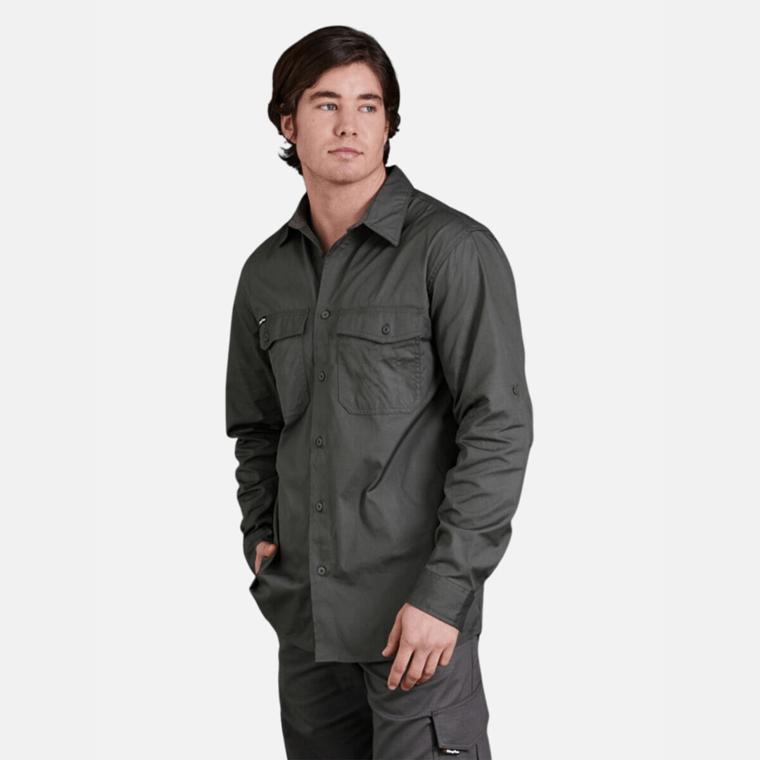 Model wearing KingGee Workcool 2 Lightweight Ripstop long Sleeve Work Shirt with cooling vents and chest pockets, available at Stewart’s Menswear Mullumbimby.