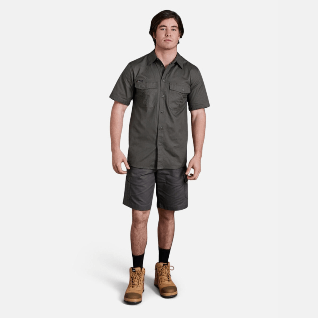 Model wearing green coloured King Gee workcool 2 ripstop cotton cargo work shorts and King Gee workcool 2 ripstop cotton vented work shirt.