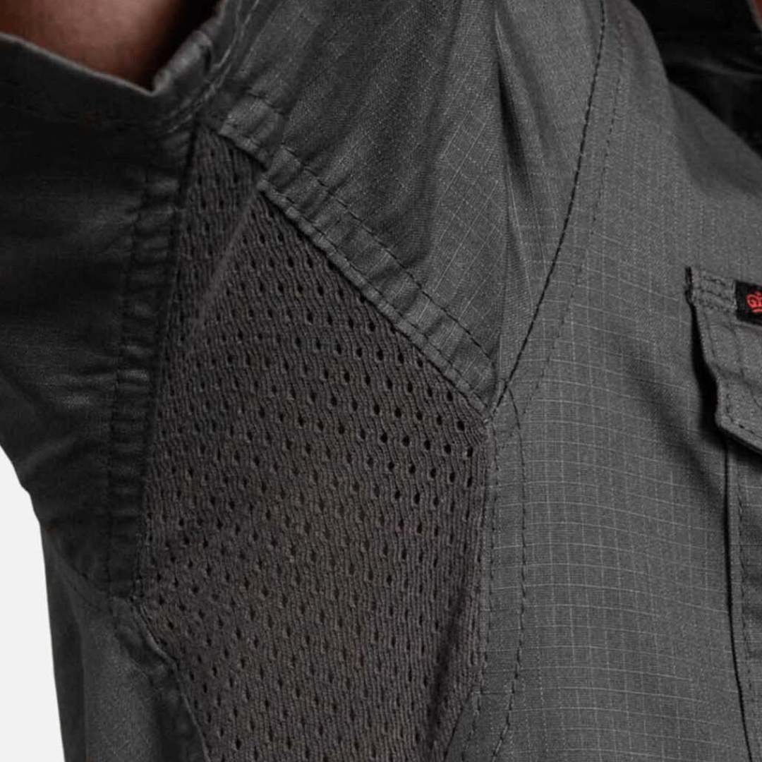 Close up view of underarm vent in green coloured King Gee workcool 2 ripstop cotton vented work shirt.