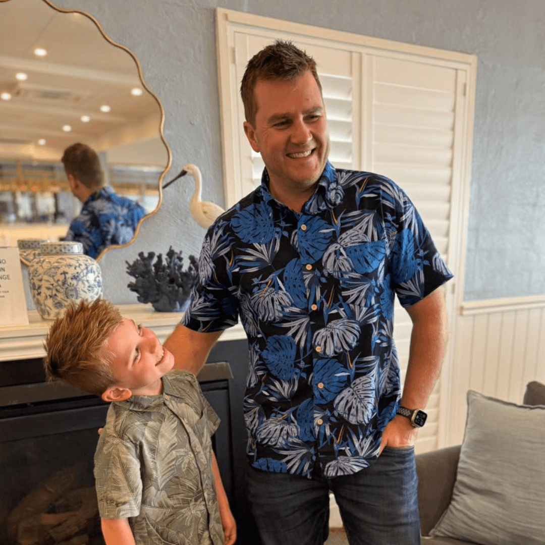 Photo of a man wearing Kingston Grange Bamboo shirt midnight palms standing beside a child wearing kingston grange bamboo shirt Amazon.