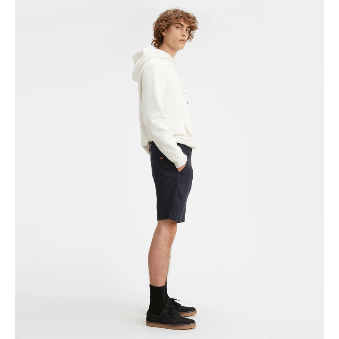 Stewarts Menswear Levi's XX Standard Chino short. Photo shows model wearing Levi's XX Standard Chino Short, Side View. Colour is Baltic Navy.