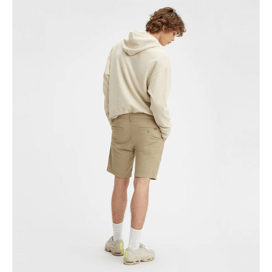 Stewarts Menswear Levi's XX Standard Chino short. Photo shows model wearing Levi's XX Standard Chino Short, Back View. Colour is True Chino, a light beige colour.