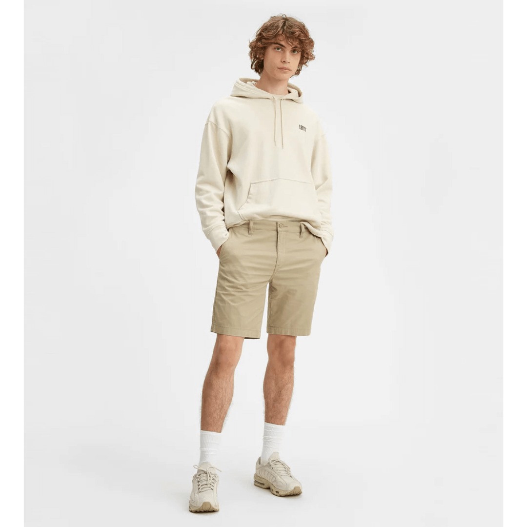 Stewarts Menswear Levi's XX Standard Chino short. Photo shows model wearing Levi's XX Standard Chino Short, Front View. Colour is True Chino, a light beige colour.