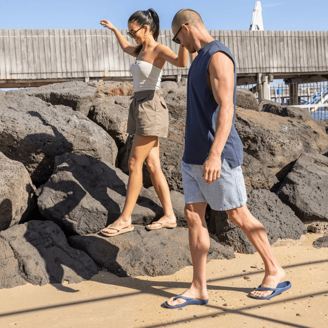 Lifestyle photo of two people wearing Lightfeet arch support thongs available from Stewarts Menswear in Mullumbimby