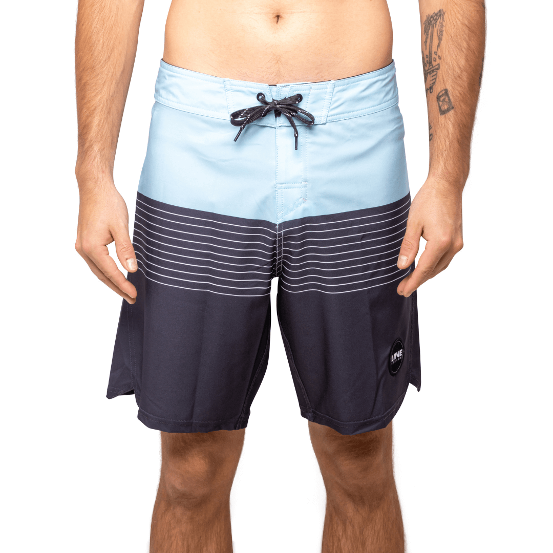 Stewarts Menswear Liive Vision Apparel. Revival Boardshort. light blue colour block and top and navy blue colour block at bottom with light blue stripes through mid-section. Fitted waist with drawcord, back patch pocket with velcro closure and key loop in the back pocket. Front View.