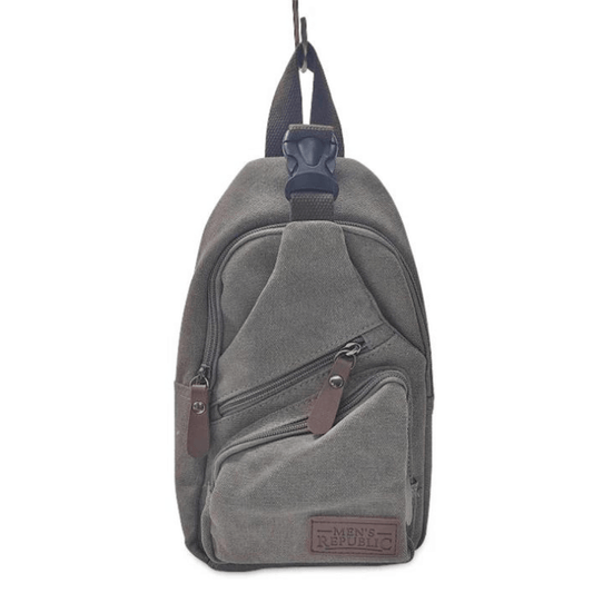 Stewarts Menswear men's gifts. Men's Republic Canvas single strap sling backpack. Colour is grey. Photo shows front view of backpack with 3 zippered sections.