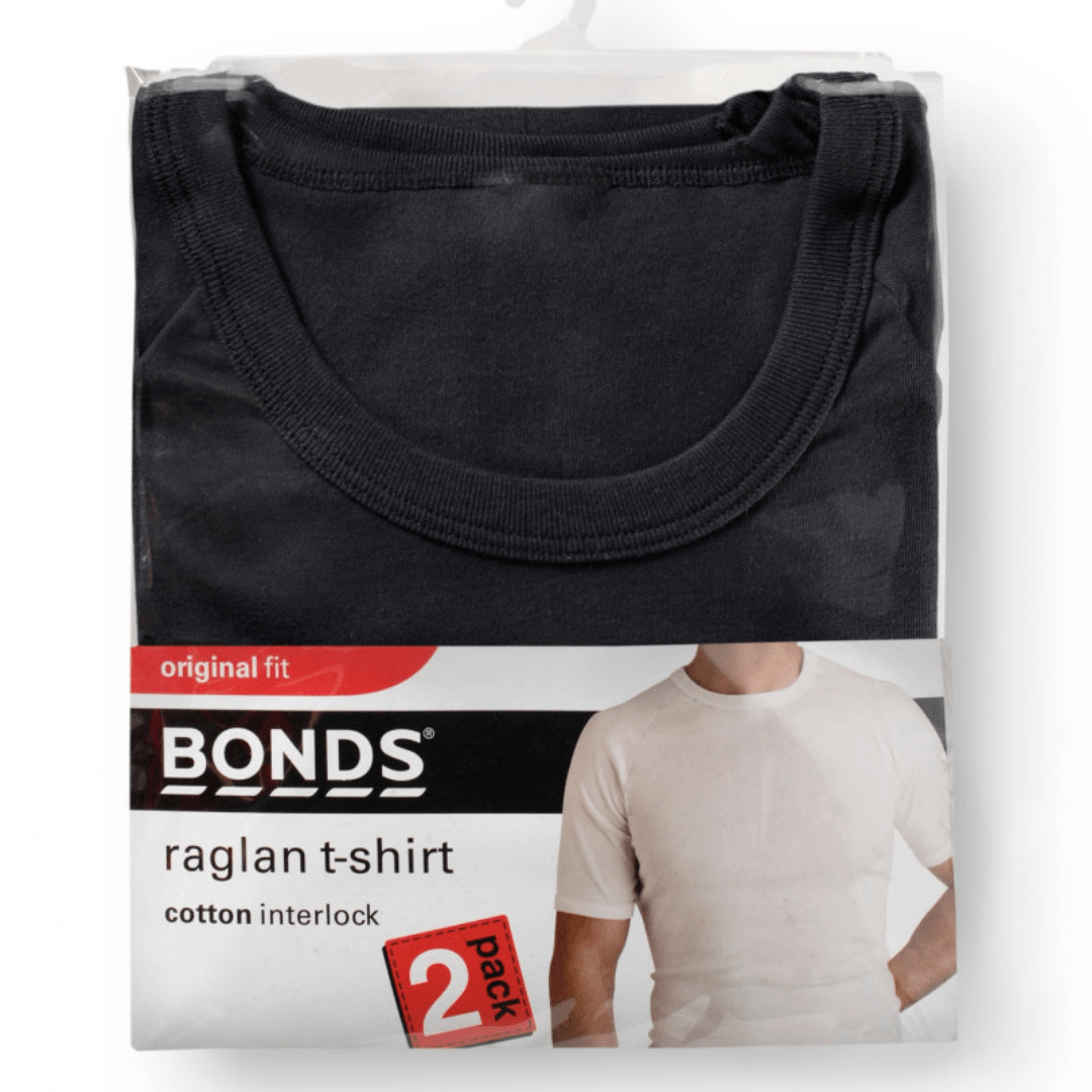 Bonds raglan t-shirt packaging with a black t-shirt. Bonds raglan t-shirt packaging (2 pack) with a black t-shirt on a white background. Bonds Original Raglan Tee Shirt available at Stewart's Menswear Mullumbimby. Soft cotton men's crew neck tee in basic colours.