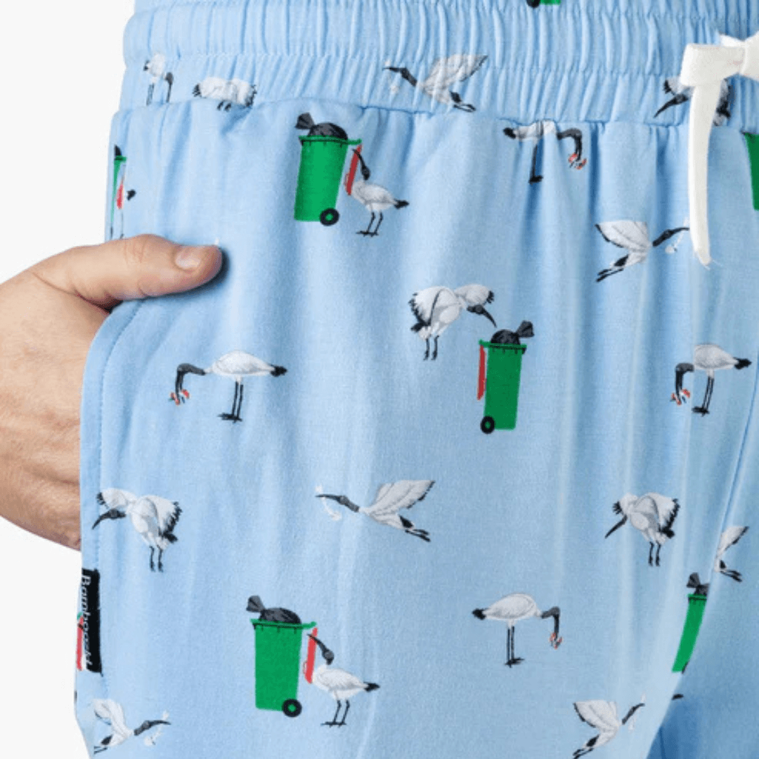 Close up view of Bamboozld men's bamboo sleep pants. Sky blue colour with bin chicken print all over available at Stewart's Menswear, Mullumbimby.