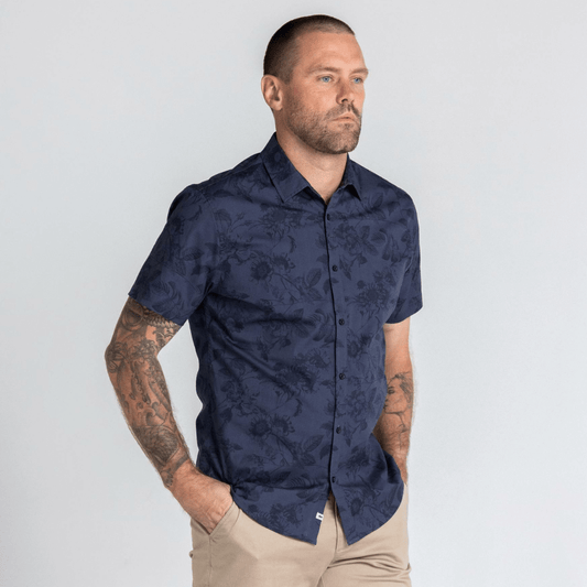 Stewart's Menswear, Mullumbimby. Photo shows model wearing stonleigh short sleeve shirt from Blackwood Apparel. Front View. Colour is charcoal with all over floral print in similar shades.
