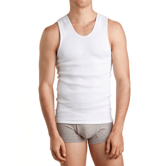 Person wearing a white chesty bond singlet and gray underwear on a white background. Bonds Chesty Bond Singlet available at Stewart’s Menswear Mullumbimby in ribbed cotton with classic men’s styling.