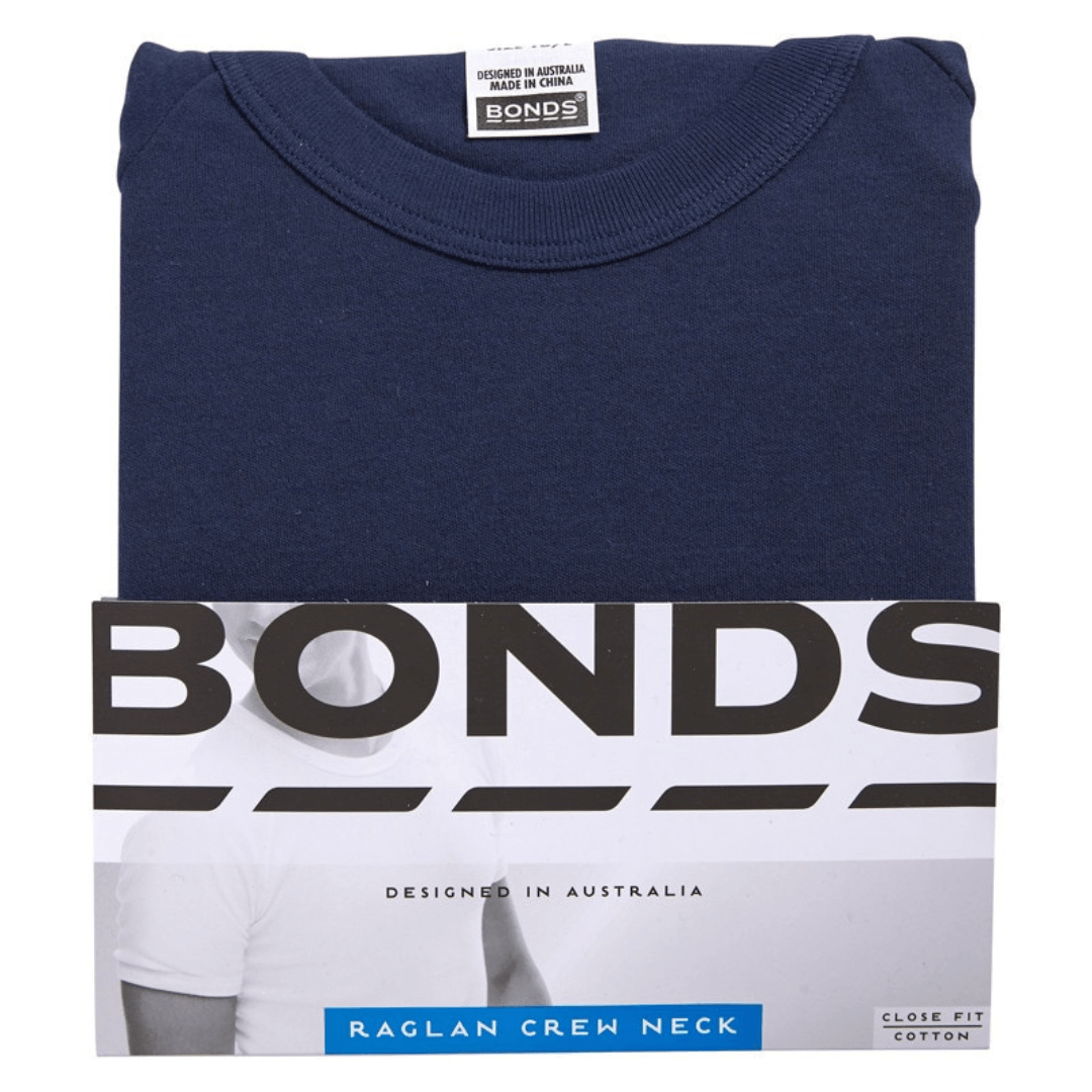 Bonds raglan t-shirt packaging with a navy t-shirt on a white background. Bonds Original Raglan Tee Shirt available at Stewart's Menswear Mullumbimby. Soft cotton men's crew neck tee in basic colours.