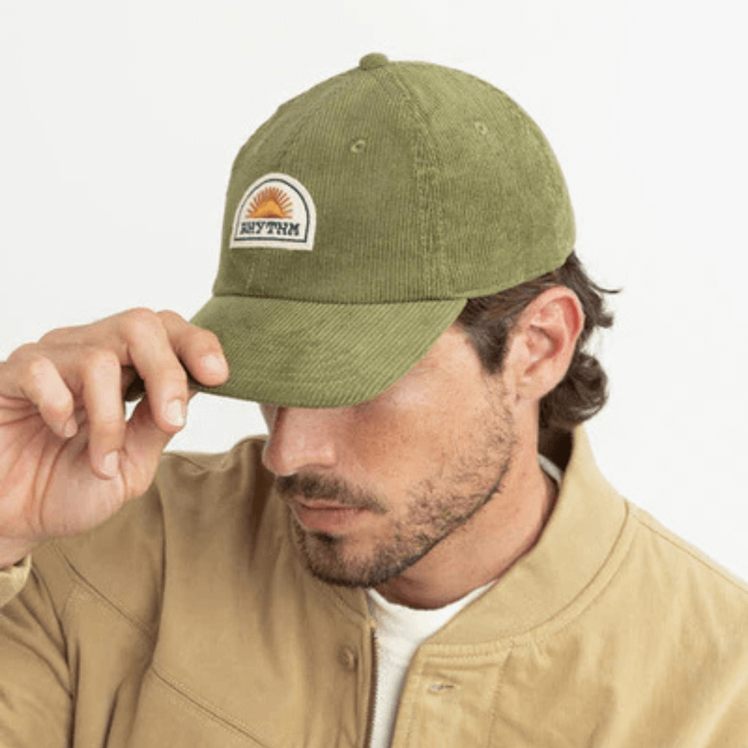 Lifestyle photo of Sage coloured Rhythm cord cap available from Stewart's Menswear, Mullumbimby