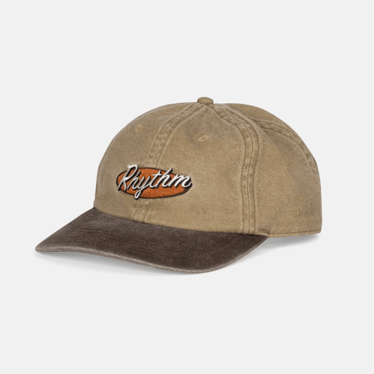 Stewart's Menswear, Mullumbimby. Rhythm Hallmark Cap. Sand coloured with embroidered Rhythm branding and darker brown coloured peak.