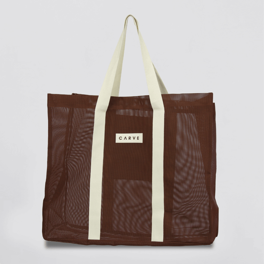 Seaside Mesh Tote Bag – Carve mesh beach bag with contrast woven handles, available at Stewart’s Menswear Mullumbimby.