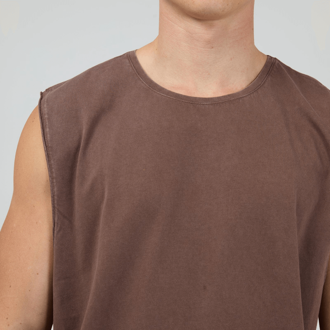 Man wearing Silent Theory basics classic muscle tee available from Stewart's Menswear in Mullumbimby. Pigment washed, chocolate colour, close up view.