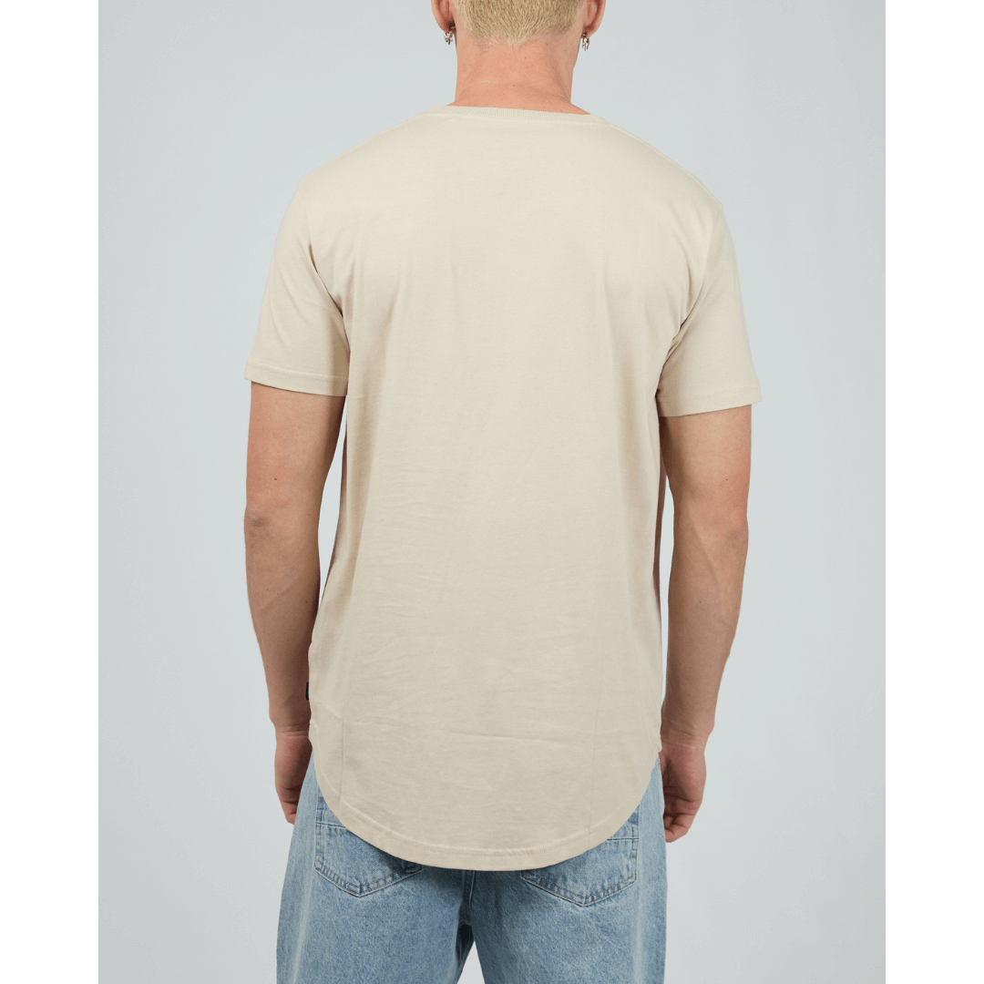 Stewart's Menswear, Mullumbimby. Product photo of model wearing Silent Theory Solid Tail Tee. Back View. Colour is Tan.