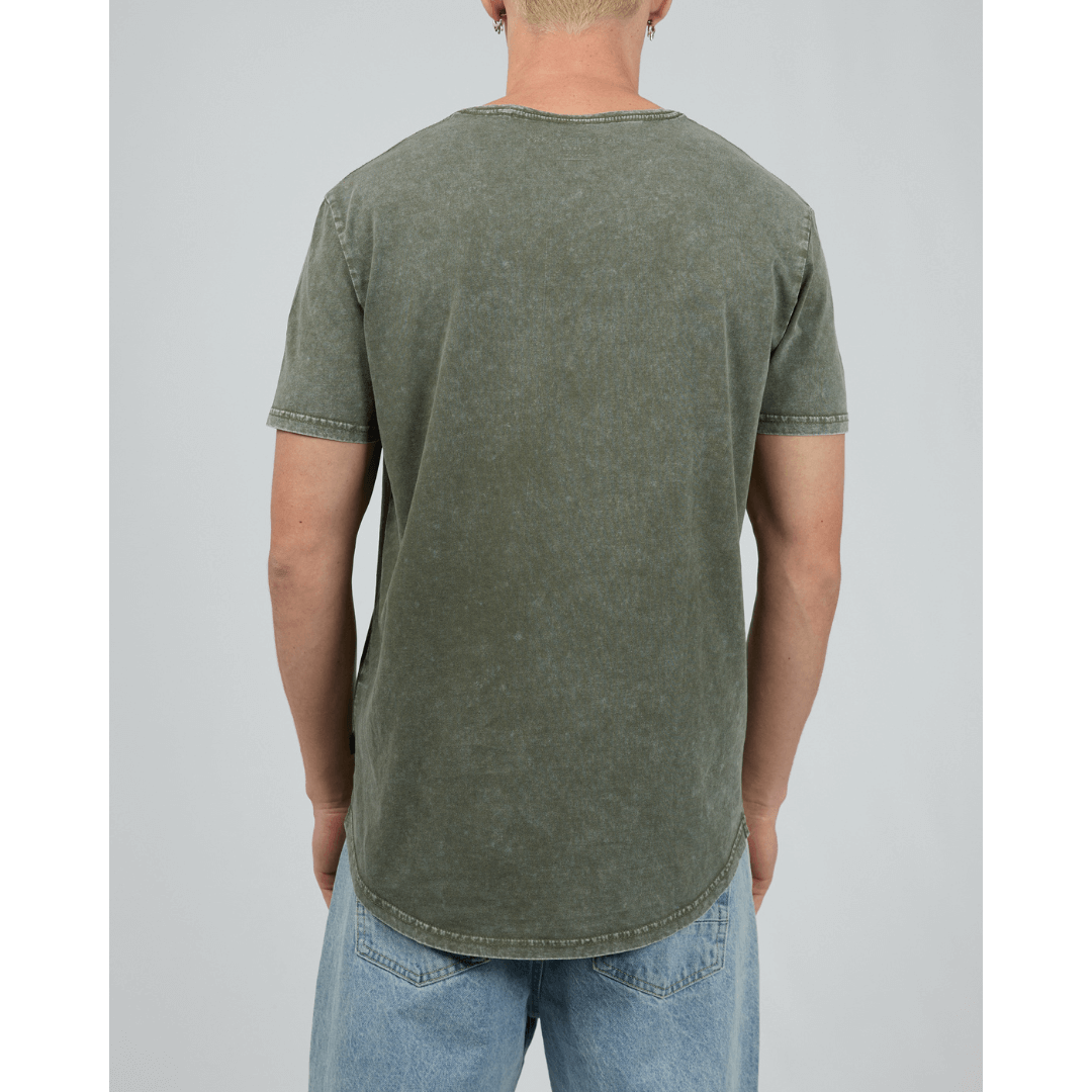 Stewarts Menswear, Mullumbimby. Photo shows model wearing  khaki coloured Silent Theory Tail Tee, back view.