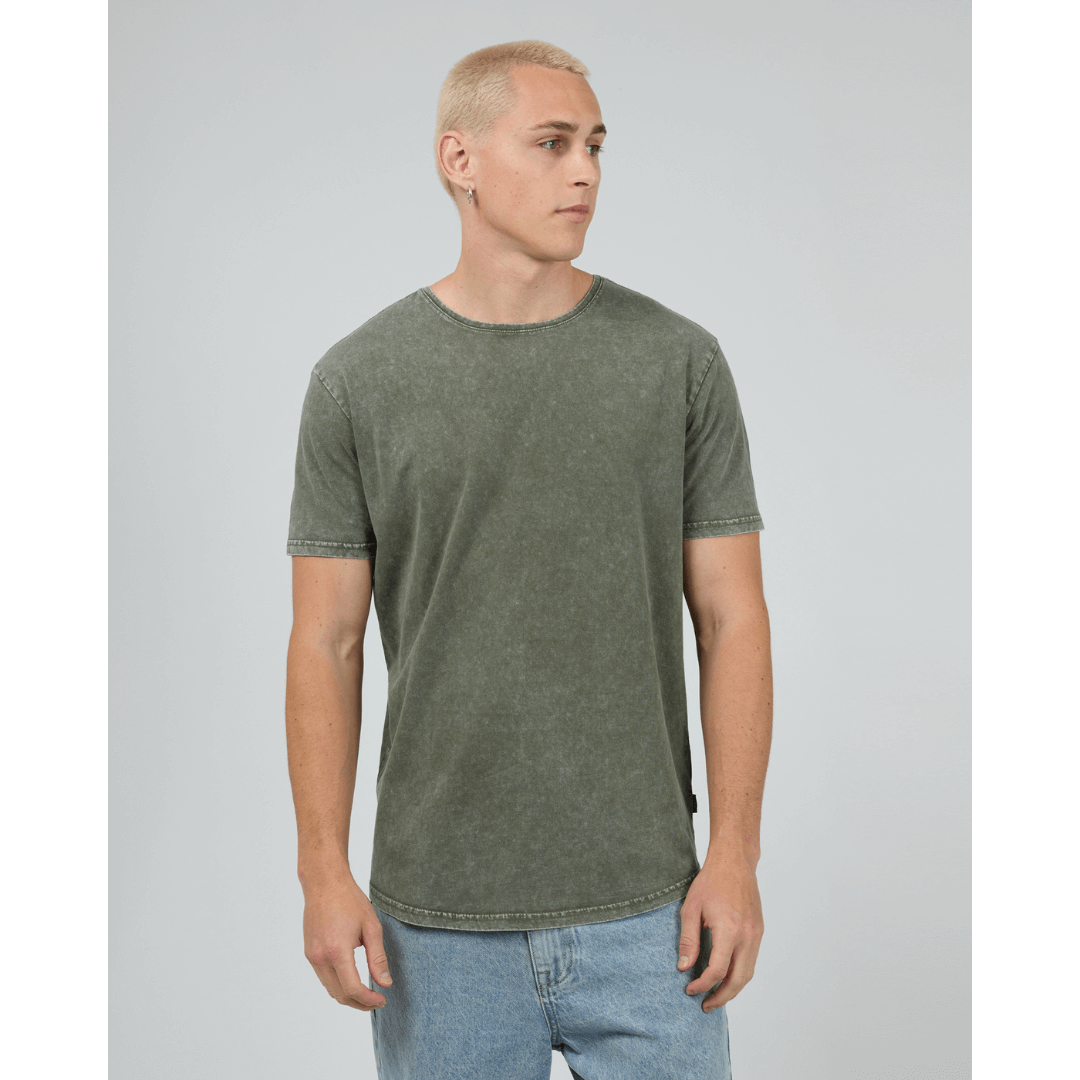 Stewarts Menswear, Mullumbimby. Photo shows model wearing  khaki coloured Silent Theory Tail Tee, front view.