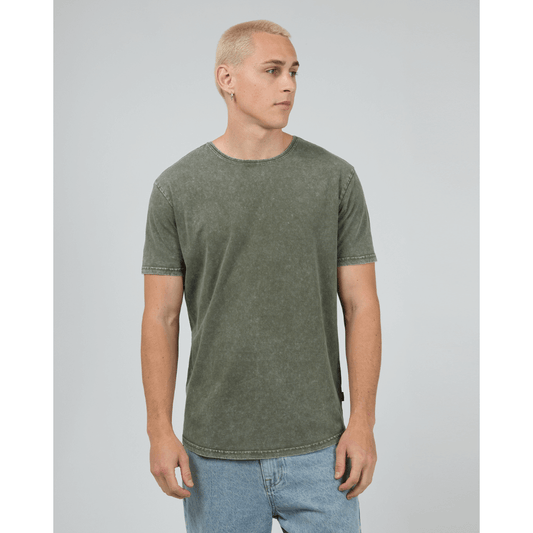 Stewarts Menswear, Mullumbimby. Photo shows model wearing  khaki coloured Silent Theory Tail Tee, front view.